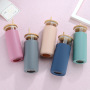 Promotional Reusable 500ml Straw Glass Dinking Water Bottle Tumbler With Silicone Sleeve  Glass Tumbler Cup With Bamboo Lid