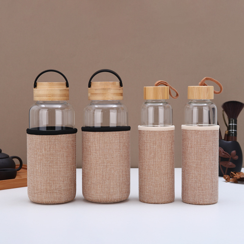 Customized Large Capacity High Borosilicate Single Wall Glass Water Bottle with Bamboo Lid for Outdoor Use