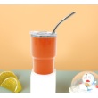 Orange with metal straw