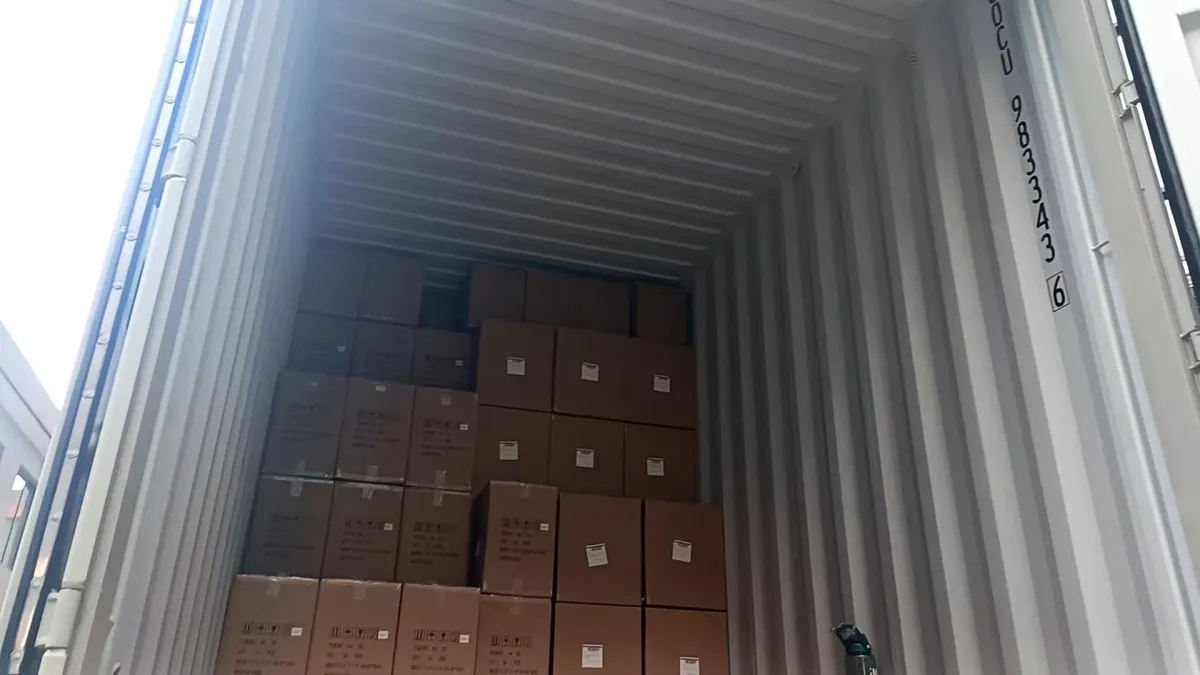 Drinkware export cartons stacked inside a shipping container