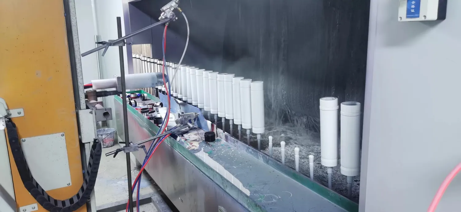Metal bottle bodies moving through a drinkware production line at the Bluegreen factory