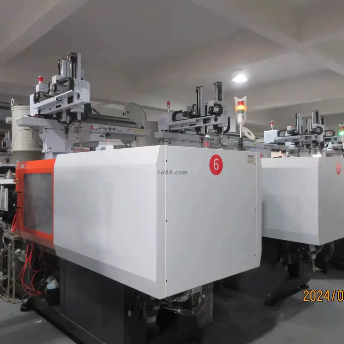 Injection molding machines in the plastic drinkware production area