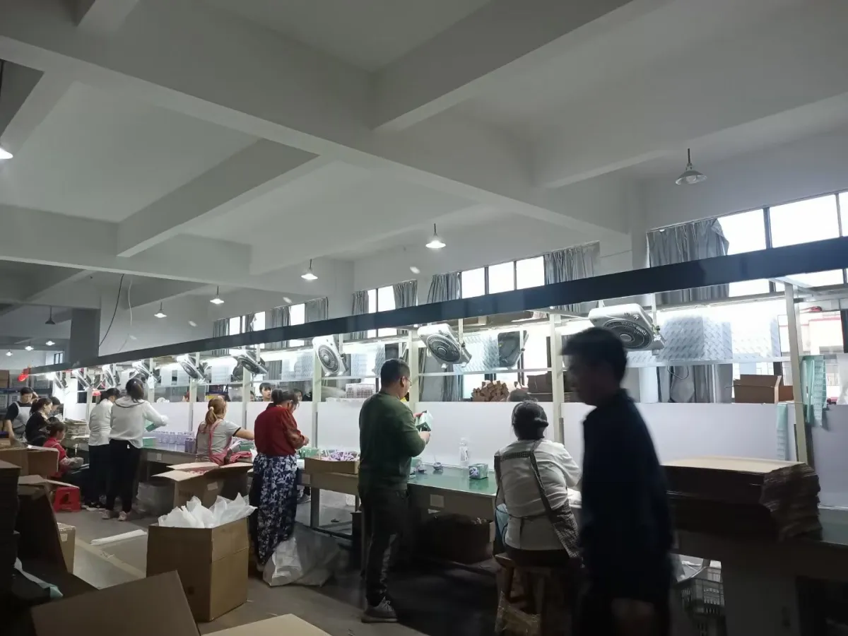 Visitors reviewing a drinkware production line inside the factory