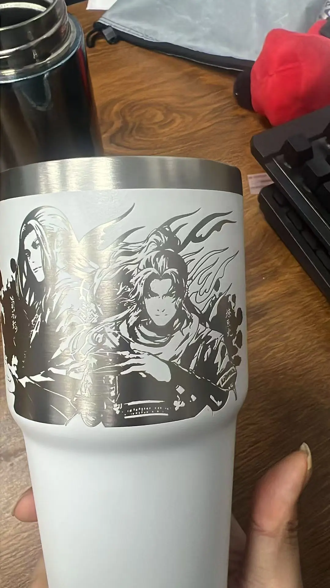 Large rotary laser engraving across a curved coated stainless steel tumbler