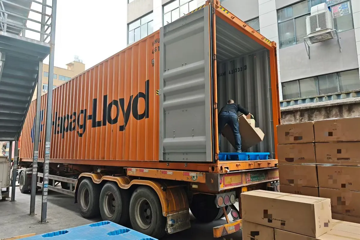 Drinkware export cartons being loaded into a shipping container