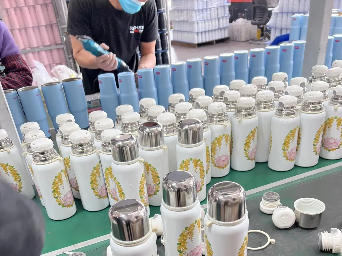 Threaded tumbler lid components arranged for production assembly