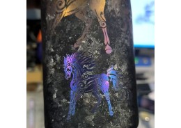 Gold, blue, and purple laser markings on titanium drinkware