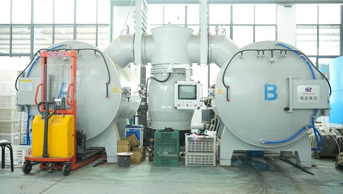 Twin vacuum furnaces used in insulated drinkware production