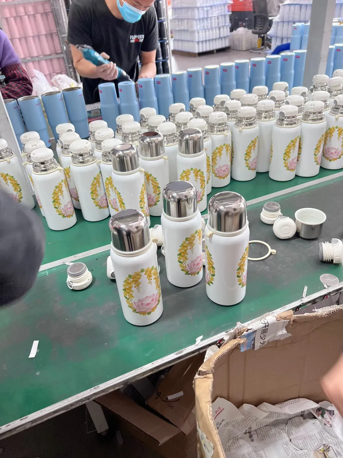 Custom printed insulated bottles prepared for final inspection and packing