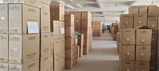 Cartons stacked in a drinkware factory warehouse before shipment