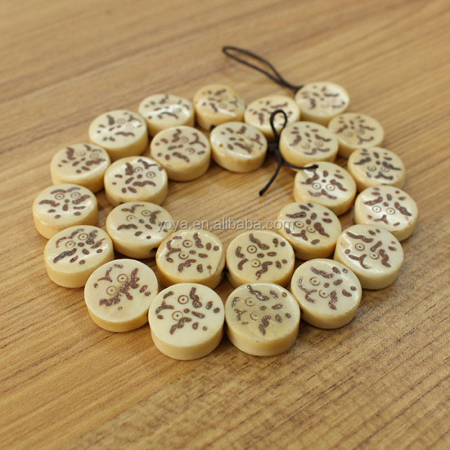 OB009 Wholesale Hand Carved Bird eye picture chess Bone round beads