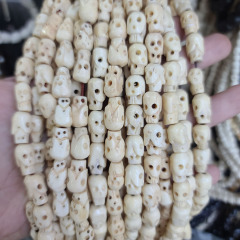OB077 Tiny hand carved Ox Bone Skull ghost beads, bone skeleton beads