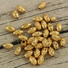 JS1228 Wholesale matte gold carved flower rice beads,gold drum spacer beads