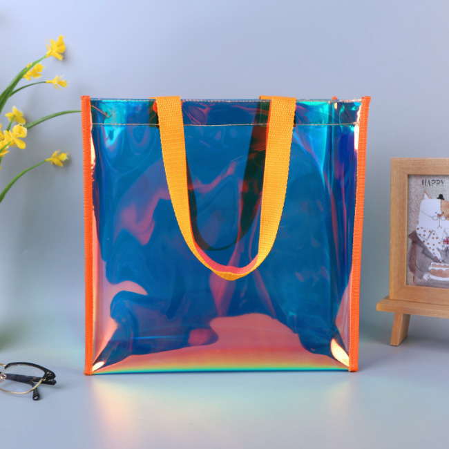 La bolsa de regalo con publicidad láser de PVC modificó el logotipo personalizado de la bolsa de cosméticos de plástico transparente de colores