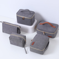 Nueva bolsa de maquillaje Oxford de viaje de tela de gran capacidad, bolsa de almacenamiento impermeable portátil de cinco piezas, stock de fábrica