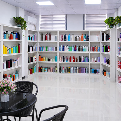 Colorful water bottles and tumblers displayed in the showroom