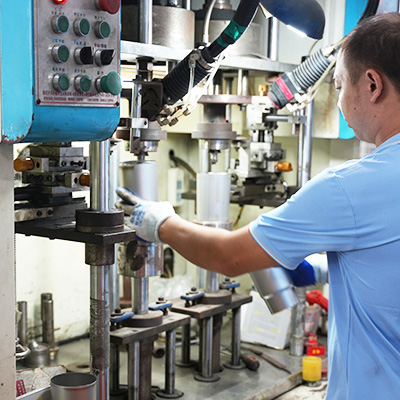 Worker operating stainless steel cup body processing equipment